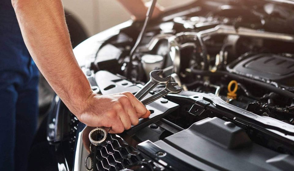 Mechanic performing an engine repair